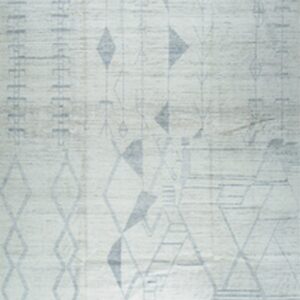 Light off-white rug with a muted blue-grey abstract geometric pattern, including diamond shapes and fringes.