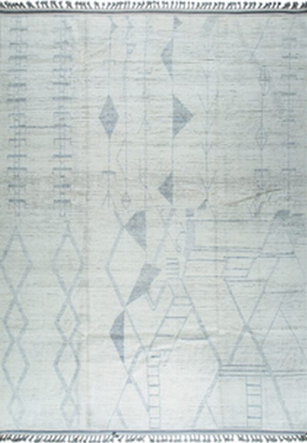 Light off-white rug with a muted blue-grey abstract geometric pattern, including diamond shapes and fringes.