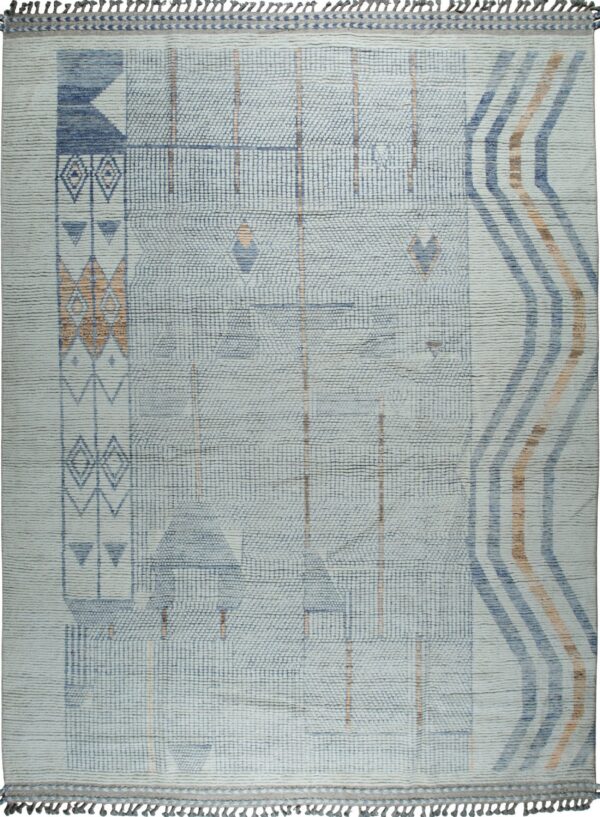 Textured light blue rug with geometric block patterns and diagonal rust and navy stripes and tassels.