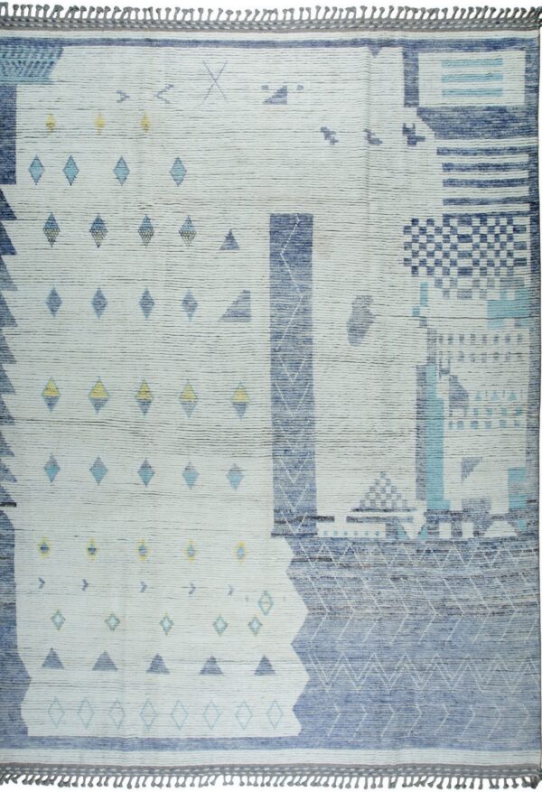 Ribbed white rug featuring an abstract geometric pattern in shades of blue, aqua, and yellow with fringed edges.