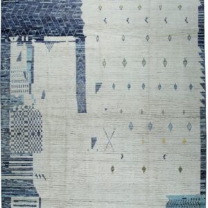Textured cream and deep blue abstract rug with small geometric yellow and blue accents.
