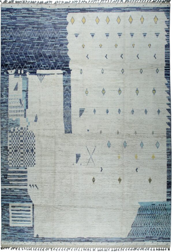 Textured cream and deep blue abstract rug with small geometric yellow and blue accents.