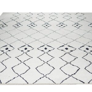 Textured white rug featuring a repeating large diamond lattice pattern in dark geometric lines.