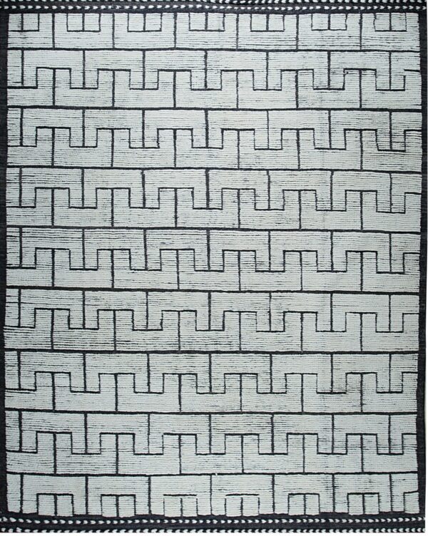 Highly textured black and off-white rug with a repeating horizontal stepped geometric pattern.