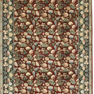 Traditional deep red rug with dense light-colored floral motifs and a contrasting dark navy blue border.