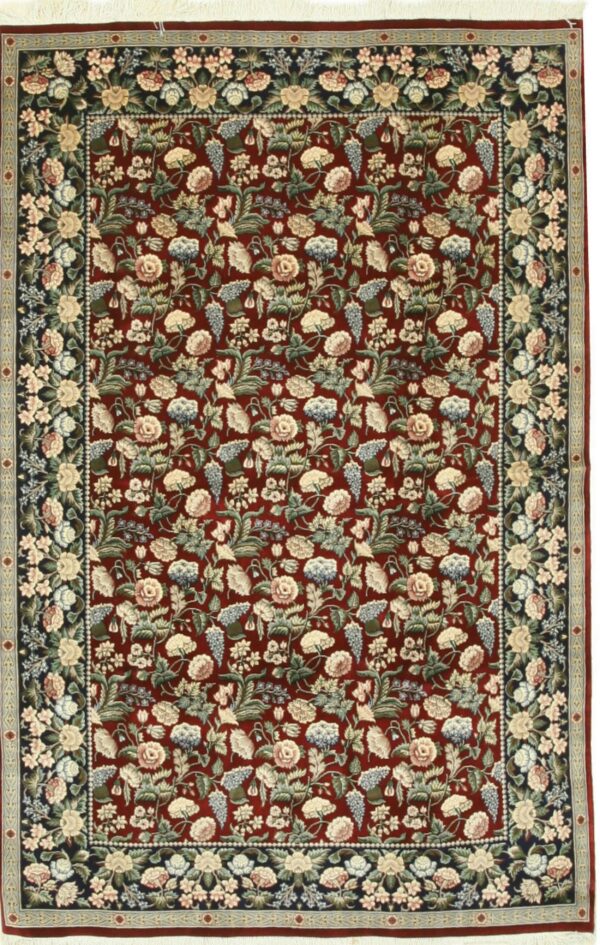 Traditional deep red rug with dense light-colored floral motifs and a contrasting dark navy blue border.