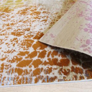 A rust and cream abstract low-pile rug lies on wood flooring with the patterned backing revealed.