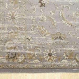 The light gray rug features a traditional distressed pattern in cream and gold on blonde wood.