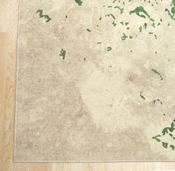 Low-pile abstract rug in neutral beige tones with scattered dark green elements on wood floor.