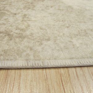 Shimmering beige velvet rug texture with bound edge on glossy light wood flooring.