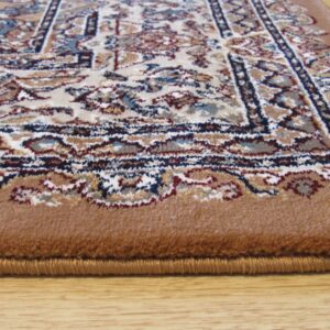 Low-pile rug with ornate pattern in cream, blue, and brown, featuring a wide solid tan border on wood flooring.