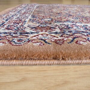 Close-up showing the tan edge, high pile, and traditional red, blue, and cream pattern on wood flooring.