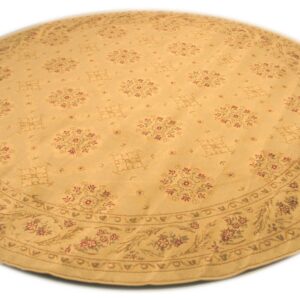A round tan rug displays a repeating red and brown traditional floral pattern and a wide decorative border.