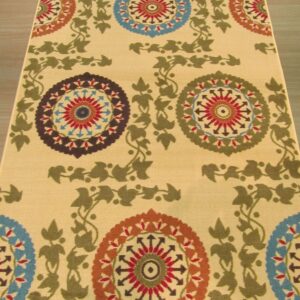 Yellow runner rug featuring alternating colorful medallions and connecting olive green leafy vines on wood flooring.