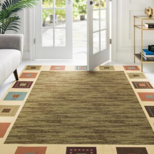 Olive green striated rug with a cream border featuring multi-colored geometric squares in a bright room.