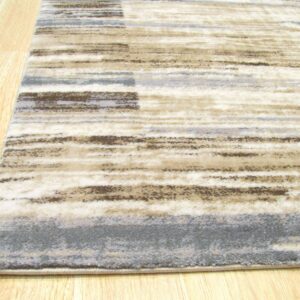 Low-pile rug featuring abstract horizontal stripes in cream, brown, and slate gray on light wood floor.