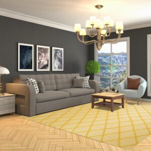 Bright yellow rug with white concentric diamond patterns anchors a gray sofa on light wood flooring.