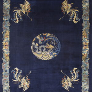 Deep blue rug with corner phoenixes, a central medallion, and a wide border of stylized blue dragons.