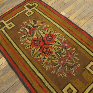 Textured brown runner featuring red and green floral designs and geometric borders on distressed wood planks.