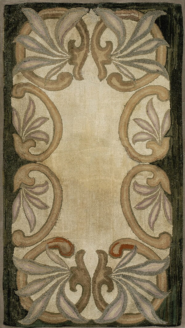 Beige rug with a hooked texture and an ornamental border design in brown, taupe, and dark green.