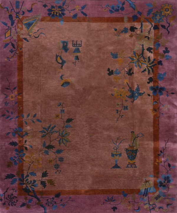 Ornate rosy brown rug with a wide mauve border and detailed blue and yellow floral vine and object designs.