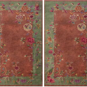 Two rugs with rust-red fields and green borders decorated with flowing multicolored floral patterns.