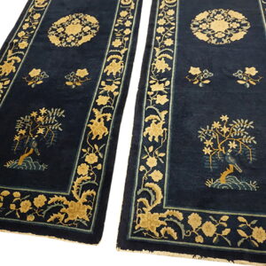 Two navy runners with golden yellow and light blue floral patterns, including a medallion and tree motif.