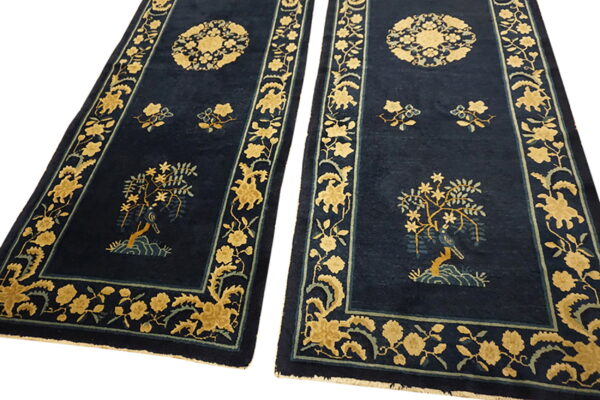 Two navy runners with golden yellow and light blue floral patterns, including a medallion and tree motif.