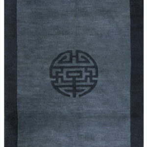 A dark slate runner rug featuring a darker border and a central circular geometric medallion.