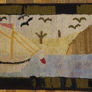 Textured rug featuring a cream sailboat, brown land, and blue water, framed by an olive and black border.