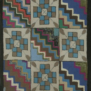 Patchwork hooked rug with alternating squares of multicolored zigzag steps and beige floral checks.