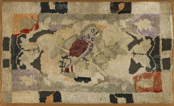 Textured beige rug featuring a folk art style bird and geometric blocks in muted red, purple, and gray.
