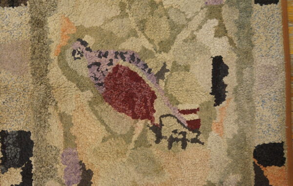 Highly textured looped rug featuring abstract organic shapes in muted beige, olive, deep red, and lavender colors.