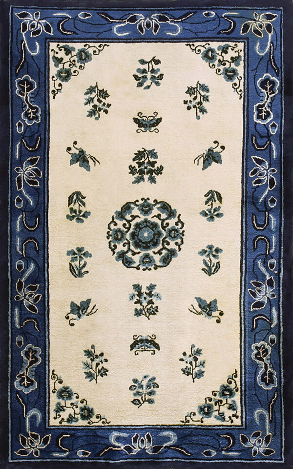 Cream field rug with blue floral sprays and a central medallion framed by a wide blue border.