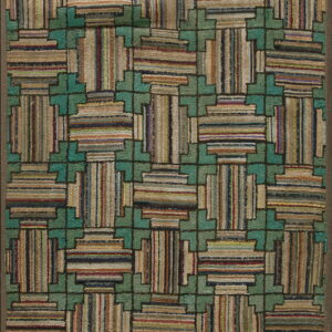 Geometric hooked rug with teal interlocking pattern surrounding multicolored striped block shapes.