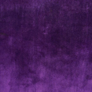 Plush, deep purple solid-colored rug texture shown in close-up above light wood flooring.