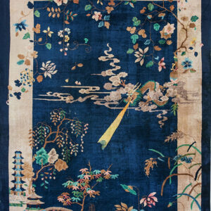Navy blue rug with a scenic landscape pattern including a dragon, pagodas, trees, and multi-colored floral borders.