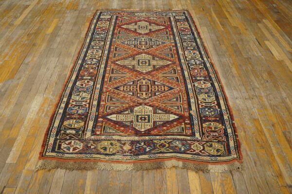 Geometric runner rug featuring intricate designs in terracotta, navy, and cream on rustic wooden floorboards.