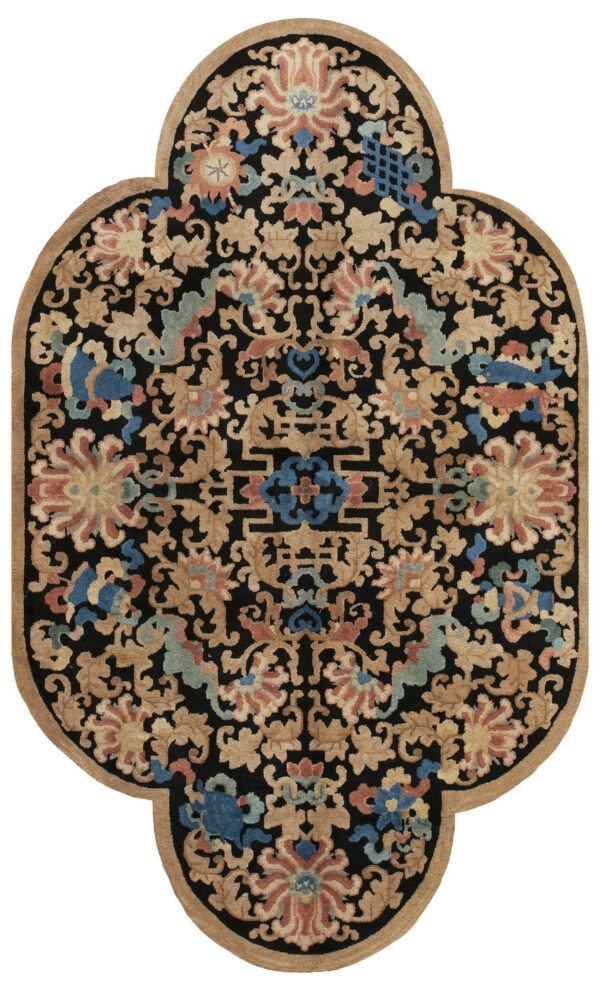 Black lobed rug with dense floral patterns in tan, blue, and coral, featuring a tan outer border.