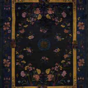 Dark blue rug featuring a gold framed border and colorful floral vines and lanterns on a dark field.