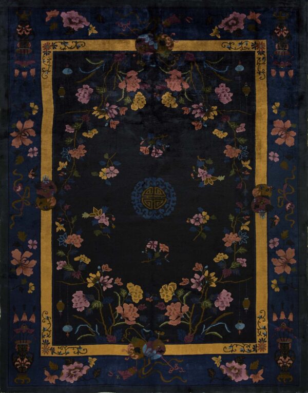 Dark blue rug featuring a gold framed border and colorful floral vines and lanterns on a dark field.