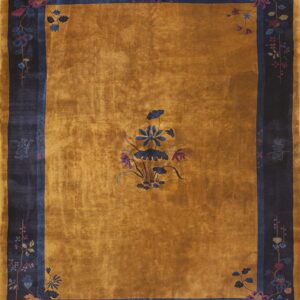 High-sheen gold rug with a dark navy border, stylized flowers, and Chinese character accents.