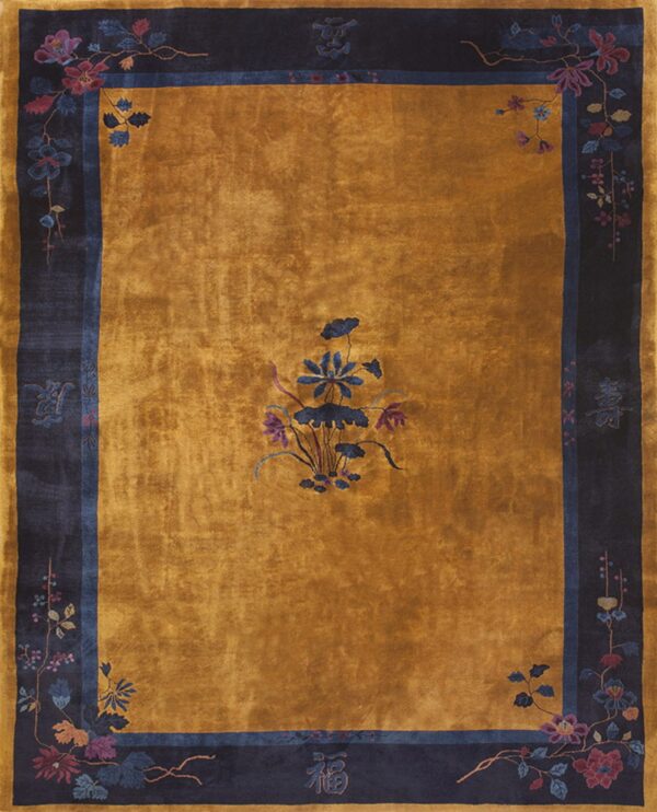 High-sheen gold rug with a dark navy border, stylized flowers, and chinese character accents.