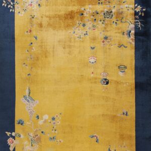 A navy blue border frames a golden yellow field decorated with detailed flowers, hanging lanterns, and a white dragon motif.
