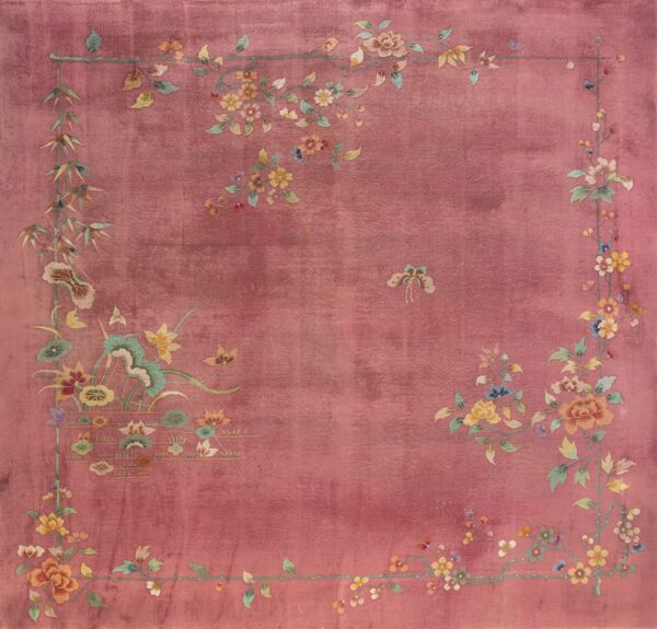Velvety rose square rug featuring a delicate floral border and vines with multicolored blossoms and a central butterfly.