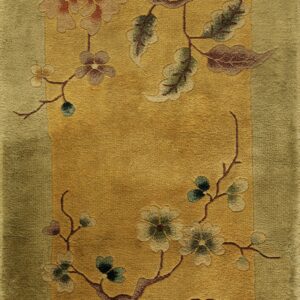 Gold-field rug featuring winding branches and pink and green floral patterns within an olive green border.