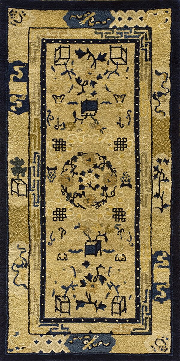 A runner rug with a gold field, navy borders, and traditional blue chinese pictorial motifs.