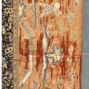 Ornate, narrow textile panel features embroidered figures and flowers on a salmon field with a black floral border.