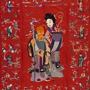 A vertical red embroidered tapestry depicts large and small figures among stylized flowering branches and foliage.