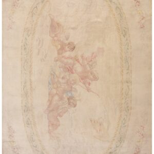 Cream rug featuring a large center medallion showing pastel figures surrounded by pale pink rose borders.